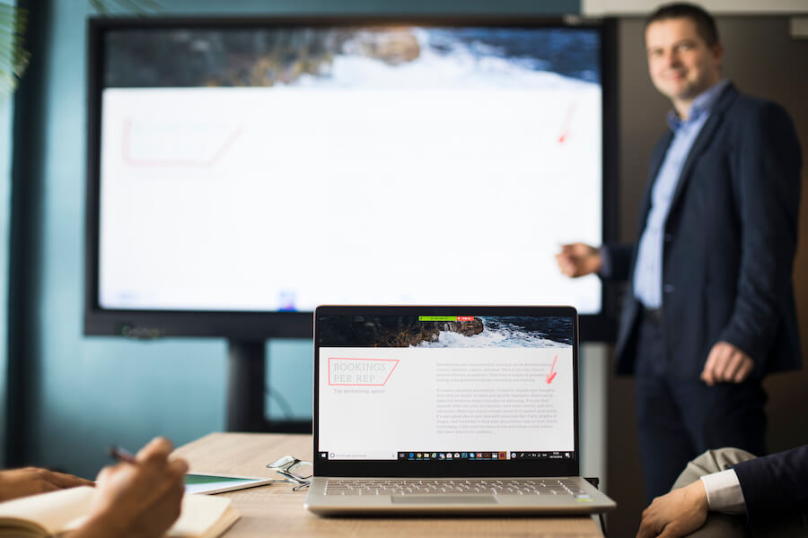 person giving presentation with interactive display