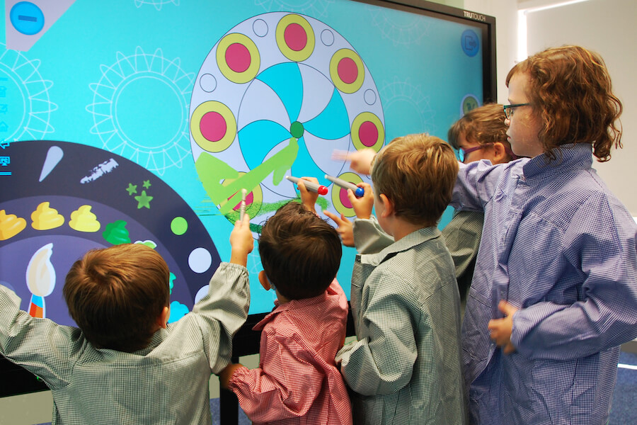 multiple students interacting in classroom display