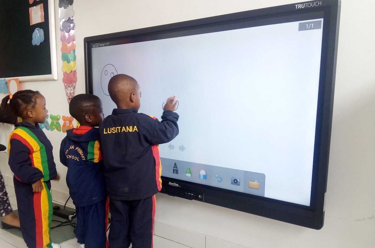 multiple students interacting in classroom display