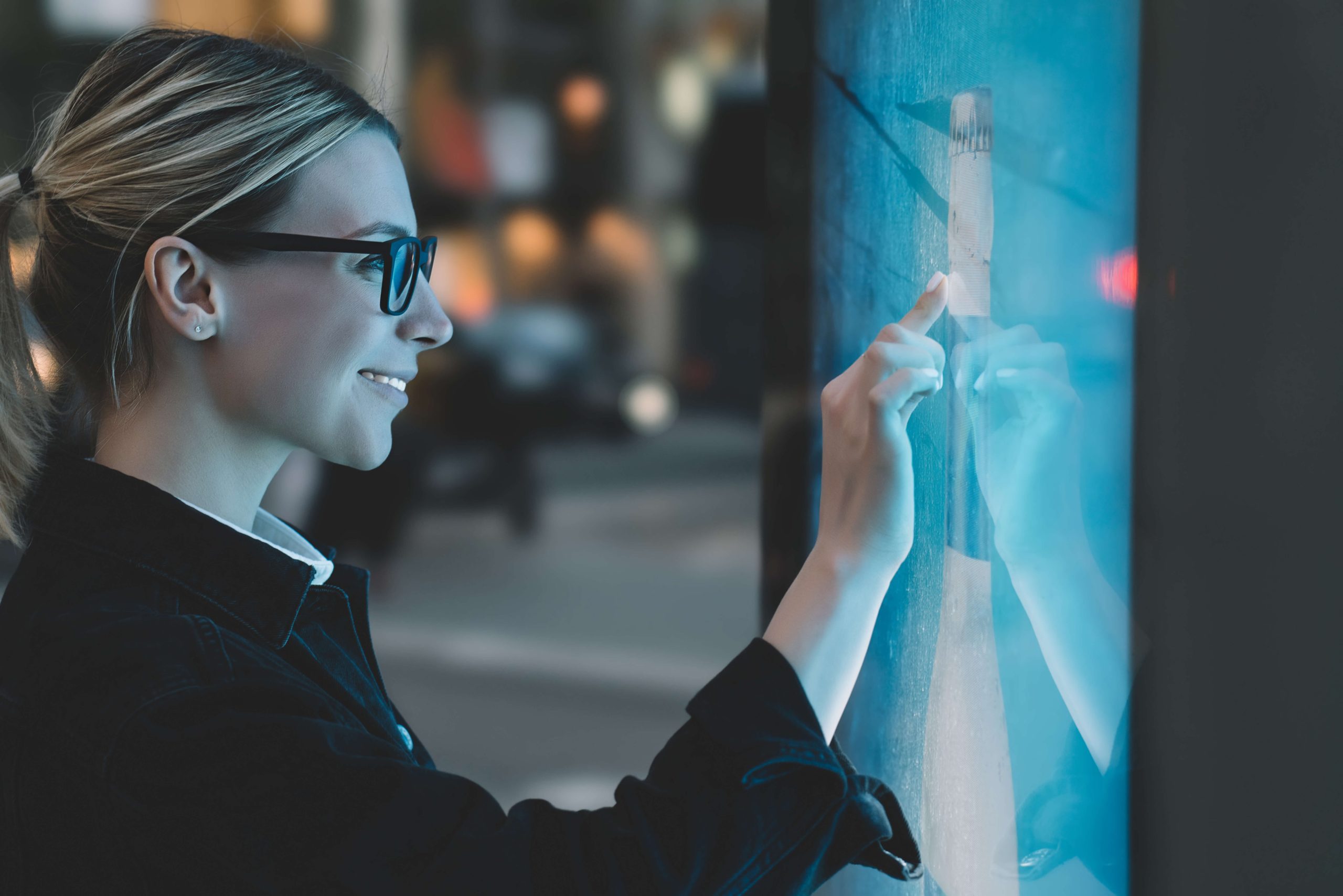 woman writing and drawing on the interactive display